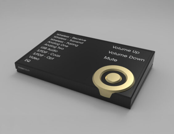 black audio control device with labeled buttons for volume and various audio inputs, featuring a gold circular knob.